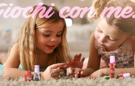 Two little girls painted their nails at home.